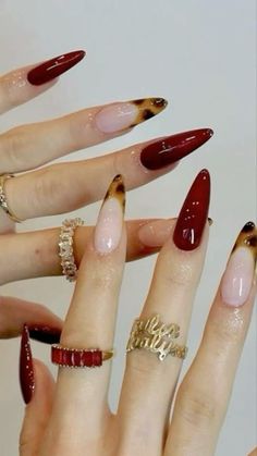 many different types of nails with red and gold accents