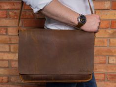 This men`s leather briefcase bag is the perfect choice for men who love sleek and practical accessories. Handmade with the finest Italian leather, this bag features a compact, medium-sized shape that's perfect for carrying laptops, documents, and other essential items. The bag boasts a range of interior pockets that are perfect for storing earbuds, mobile phone wires, bank cards, and other essentials. It also has a hidden compartment designed specifically for your documents and full-size folders Leather Laptop Bag As Gift, Leather Laptop Bag With Sleeve, Leather Briefcase With Soft Leather As Gift, Leather Briefcase Perfect For A Gift, Soft Leather Briefcase As Gift, Leather Laptop Bag With Sleeve As Gift, Leather Bag With Laptop Sleeve For Gift, Leather Satchel With Laptop Sleeve As Gift, Leather Laptop Sleeve Bag As Gift