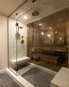 a walk in shower sitting inside of a bathroom