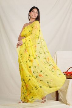 This is a beautiful pure chiffon light weight saree .  Fabric - Pure chiffon  Color - Yellow color  Technique - Hand painted Saree length - 5.5 mtr.  Blouse - same running blouse 90 cm. Wash and care - Dry clean only . Please note - color may be vary a little due to sunlight and photography . Please message us after purchasing in case you want fall and Pico done it not .  No extra charges for fall and Pico but inform us .  Blouse stitching is also available . Floral Saree Chiffon, Yellow Saree For Haldi, Saree For Haldi, Hand Painted Saree, Saree Chiffon, Saree Yellow, Painted Saree