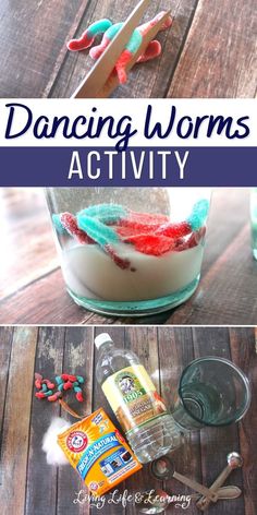 a glass jar filled with candy worms and other items on top of a wooden table