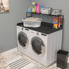 a washer and dryer sitting in a room next to a shelf filled with laundry