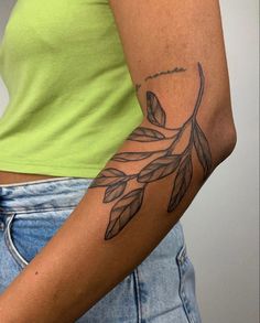 a woman with a tattoo on her arm