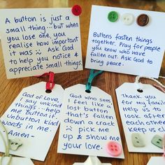 four pieces of paper with words and buttons attached to them