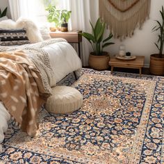 a large rug is on the floor next to a bed