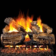 a fireplace with logs and flames burning in it