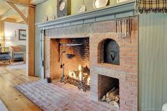 a fireplace in a living room filled with furniture