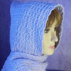 a mannequin head wearing a blue knitted hood