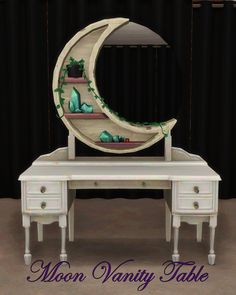 the moon vanity table is painted white with green accents