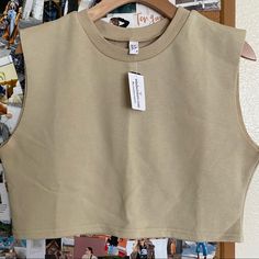 Cropped Casual Sleeveless Sweater #Cropped. Pair It With Biker Shorts Or Joggers. #Sizem Trendy Beige Vest Crop Top, Casual Cropped Vest Crop Top, Khaki Fitted Sleeveless Crop Top, Khaki Sleeveless Cotton Tank Top, Khaki Cotton Tank Top, Khaki Cotton Sleeveless Tank Top, Sleeveless Khaki Cotton Tank Top, Trendy Cotton Cropped Vest, Fitted Sleeveless Khaki Crop Top