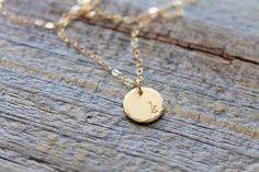 "A beautiful handmade gold initial necklace. This gold filled disc is hand stamped with your choice of initial(s) and strung from a delicate gold filled chain. This dainty initial necklace is the perfect gift for women. A timeless personalized initial necklace is the perfect addition to any wardrobe. Personalized jewelry makes a great birthday gift, anniversary gift, gift for her, christmas gift, graduation gift, wife gift, grandma gift, etc. D E T A I L S: Disc - 14k gold filled - Satin finish Handmade Gold Charm Necklace For Best Friend, Handmade Gold Charm Necklaces For Best Friend, Gold Initial Pendant Necklace For Best Friend, Hand Stamped Gold Necklace For Best Friend, Simple Gold Charm Necklaces For Bridesmaids, Gold Charm Necklace For Bridesmaid Gift, Simple Gold Charm Necklace For Bridesmaids, Handmade Gold Initial Necklace In Minimalist Style, Minimalist Gold Initial Necklace Hand Stamped