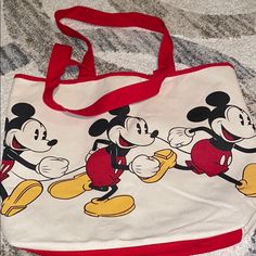 New Mickey Mouse Tote Casual Red Bag For Disney Fan Events, Red Mickey Mouse Casual Bag, Casual Red Mickey Mouse Bag, Disney Mickey Mouse Bags For Disney Fan Events, Multicolor Mickey Mouse Bag For Disney Trips, Multicolor Disney Bag With Mickey Mouse Design, Multicolor Disney Mickey Mouse Bag, Disney Mickey Mouse Bags For Disney Trips, Mickey Mouse Bag