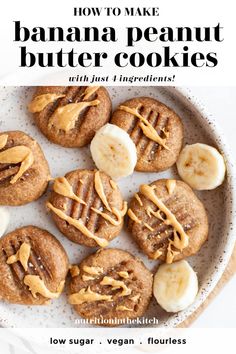 cookies with peanut butter and bananas on a plate next to a glass of milk in the background