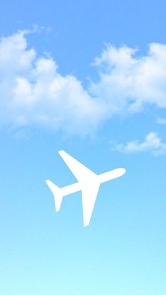 an airplane flying in the blue sky with white clouds above it on a sunny day