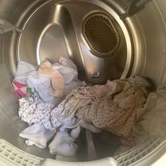 a washing machine filled with lots of clothes