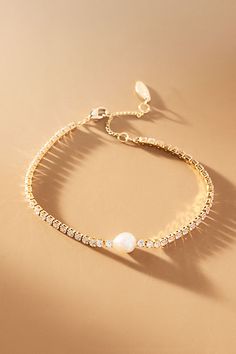 The Single Pearl Bracelet offers timeless elegance with its understated simplicity, adding a touch of sophistication to any ensemble. | Single Pearl Bracelet by Anthropologie in Gold, Women's, Gold/Plated Brass/Freshwater Pearl Gold Bridal Bracelet, Maid Of Honor Jewelry, Wedding Jewelry Pearl, Gold Elegant Jewelry, Wedding Bracelets For Bride, Useful Bridesmaid Gifts, Gold And Pearl Bracelet, Unique Bridesmaid Gifts, Jewelry For Bridesmaids