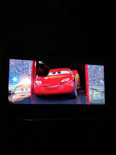 the cars on the screen are being projected