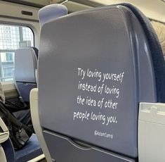 an airplane seat with a poem written on the back and seats in front of it