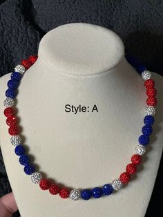 Patriotic Adjustable Colorful Beads Jewelry, Adjustable Patriotic Jewelry With Colorful Beads, Adjustable Patriotic Red Necklace, Patriotic Round Beads Necklace As Gift, Patriotic Multicolor Necklaces For Gifts, Patriotic Round Beads Necklace Gift, Adjustable Blue Patriotic Necklace, Patriotic Beaded Necklace For Gift, Adjustable Patriotic Necklaces As A Gift