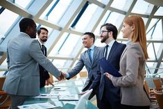 three business people shaking hands in an office setting with the words newton written on it