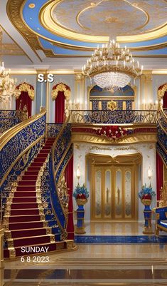 an ornately decorated foyer with red and blue carpeted stairs, chandeliers and gold trimmings