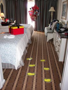 the room has been decorated with yellow and blue plates on the floor, along with other decorations