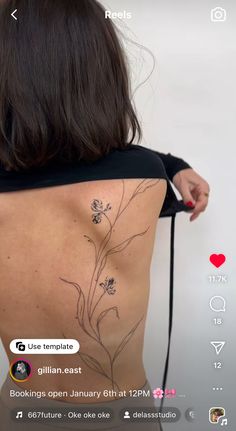 the back of a woman's body with flowers on it