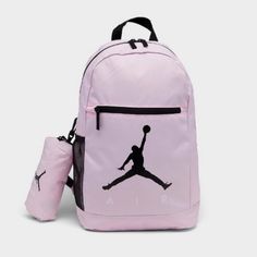 This Air Jordan Backpack In Pink Foam And Black Is Perfect For School Or Sports. With A Size Of 18 In X 12 In X 5 In, It Has Plenty Of Room For Your Belongings And Features Inner Dividers, Inner And Outer Pockets, And A Bottle Pocket. The Adjustable Straps And Top Handle Provide Comfort And Convenience, While The Solid Pattern And Jordan Character Family Make It A Stylish Accessory. This Backpack Is Made Of Polyester And Has A Fabric Lining, With A Zippered Closure And Accents. It Is Brand New W Air Jordan Backpack, Sporty Pink Backpack For School, Sporty Pink School Backpack, Functional Pink Sports Backpack, Pink Backpack For Outdoor Activities, Sporty Pink Backpack For Sports, Sporty Pink Standard Backpack, Functional Pink Backpack, Sporty Pink Backpack