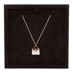 This Necklace is in 18k rose gold with a rose gold Kelly bag pendant set with 38 round brilliant diamonds with a .39 ct weight. Origin: France Condition: Pristine; new or never worn Accompanied by: Hermes box, brown jewelry box and ribbon Measurements: Length: 16 in, Pendant 18mm x 11mm Luxury Rose Gold Jewelry With Detachable Pendant, Timeless Rose Gold Diamond Pendant Necklace, Rose Gold Diamond Jewelry With Detachable Pendant, Luxury Rose Gold Necklace For Evening, Luxury Rose Gold Jewelry For Evening, Everyday Luxury Rose Gold Diamond Necklace, Timeless Rose Gold Diamond Necklace For Everyday Luxury, Rose Gold Diamond Necklace For Everyday Luxury, Luxury Rose Gold Diamond Necklace For Formal Events