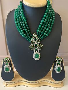 Emerald Premium Quality Sabyasachi Inspired Jewelry Set in Victorian Style. Item : Necklace with earring Color : MultiLength of the Beads including centerpiece - 8 inches (The length does not include the adjustment tie) Length of Centerpiece : 3 inches Width of Centerpiece : 1.5 inches Length of Earrings : 2 inches Width of Earnings - 1.2 inches Shop Polices -- Final Sale, No Return, No exchange - Please note Jewelry is delicate and Fragile, please handle with care.- There can be little variatio Heavy Beaded Elegant Necklaces For Wedding, Heavy Elegant Beaded Necklaces For Weddings, Elegant Heavy Beaded Necklaces For Weddings, Heavy Elegant Beaded Necklace For Wedding, Elegant Heavy Bridal Necklace With Round Beads, Traditional Green Beaded Necklace For Formal Occasions, Elegant Kundan Beads For Wedding, Traditional Bridal Necklace With Faceted Beads, Traditional Green Beads For Wedding