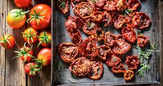 tomatoes and rosemary on a tray next to some fresh cut up tomatoes in the background