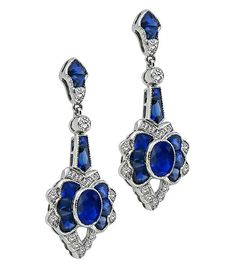 Luxury Oval Sapphire Diamond Earrings, Luxury Platinum Blue Earrings, Luxury Blue Platinum Earrings, Classic Blue Platinum Earrings, Elegant Blue Platinum Earrings, Luxury Oval Sapphire Earrings, Elegant Sapphire Earrings With Polished Finish, Luxury Blue Baguette Cut Earrings, Art Deco Oval Earrings For Formal Occasions