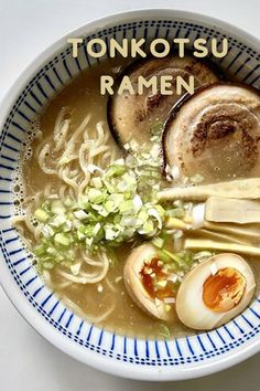 a bowl of ramen with an egg on top and some other foods in it