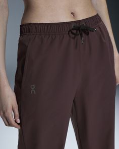 For warming up or while training, the smooth Track Pants stretch for all your movements, while two drop-in side pockets keep your essentials close. Use the Track Pants during warm-up, keep them on while training, or grab them for a recovery day. With extra-long zippers, switching in and out of your pants (and activities) is so seamless – you don't even have to take your shoes off. If there's one thing you want to feel from pants, it's that nothing is slipping or riding up. And that's why we equipped the Track Pants with a waistband cord for an adjustable fit. Meanwhile your valuables rest safely in the two front pockets. No more fumbling for your phone, keys, or energy gels. Your ultimate training partner, the soft-touch fabrics enable you to move freely thanks to its four-way stretch. Sta Micro-elastic Sports Pants With Wide Waistband, Micro-elastic Full-length Sportswear Pants, High-waist Nylon Parachute Pants With Elastic Waistband, Sporty Full-length Pants With Elastic Side Panels, Relaxed Fit Full-length Parachute Pants With Elastic Waistband, Track Pants Women, Active Life, Track And Field, Track Pants