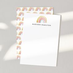 a white paper with rainbows and the words madison hamilton on it