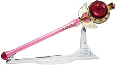 a pink and white toothbrush with gold accents