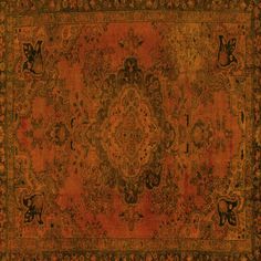 an antique rug with red and brown colors