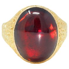 Centering an oval-shaped garnet cabochon measuring 13.5 x 17.0 mm Transparent dark/medium red in color - bezel set With ornately engraved surround and shank Depicting scrolling florals and birds Stamped with British assay marks for 18 karat gold With maker's mark Circa: 1900 Ring size: 7 1/2 and sizable Measures north to south 18.5 mm and sits 8.0 mm high Total weight: 10.2 grams Stock Number: We-12458 Luxury Gold Engraved Ring With Cabochon, Luxury Garnet Oval Cabochon Rings, Large Gemstone Rings, Dnd Wizard, Elizabeth Kubler Ross, Kubler Ross, Bird Stamp, Gold Floral, Signet Ring