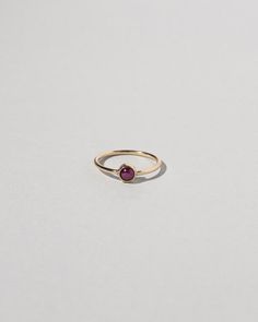 Birthstone Ring | Mociun 14k Gold Ruby Ring With Round Band, 14k Gold Birthstone Ring With Smooth Bezel For Anniversary, 14k Gold Cabochon Round Band Jewelry, 14k Gold Round Band Cabochon Jewelry, Stackable Ruby Birthstone Rings, Fine Jewelry Birthstone Ring With Smooth Bezel, Stackable Ruby Birthstone Rings With Round Band, Stackable 14k Gold Ruby Ring, 14k Gold Cabochon Sapphire Ring