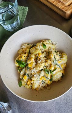 a white bowl filled with macaroni and cheese