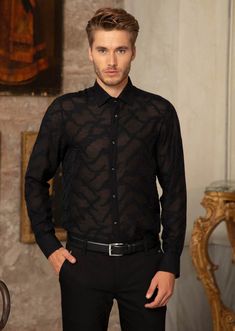 Your friends will see straight through you... partially sheer, this black Mondo shirt adds elegance and mystery that is emblematic of Mondo's freedom, empowerment and individualism Limited Edition Sheer custom fabric Semi-see through Custom metal square button French placket Button-down collar Long sleeves with rounded, single-button cuffs Rounded hem Cotton Dry clean suggested Fitted Sheer Shirt For Work, Fitted Sheer Shirt For Workwear, Sheer Fitted Button-up Shirt, Fitted Sheer Button-up Shirt, Black Slim Fit Tops With Buttons, Black Slim Fit Top For Semi-formal Occasions, Sheer Long Sleeve Shirt For Work, Designer Sheer Long Sleeve Tops, Luxury Black Party Shirt