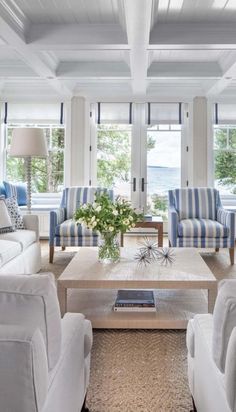 a living room with blue and white striped furniture