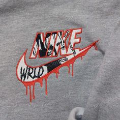 The Juice Wrld Nike Embroidered Sweatshirt is a must-have for any fan of the late rapper. Made with premium materials, this sweatshirt features an embroidered Juice Wrld graphic on the front, showcasing his iconic style. With a comfortable fit and a classic Nike design, it offers both style and comfort. Embrace your love for Juice [...] Nike Ideas, Nike Embroidered Sweatshirt, Celebrity Shirts, Sweatshirt Nike, Nike Design, Unique Sweatshirt, Embroidery Hoodie, Nike Sweatshirt, Logo Shirt