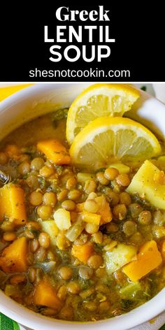 a white bowl filled with lentula soup and lemon wedges