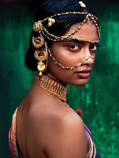 a woman with gold jewelry on her head and the words melanin in front of her face