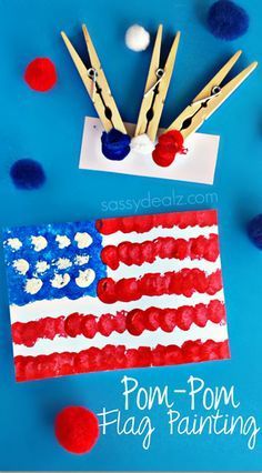 an american flag made out of popsicle sticks on top of a blue background with red, white and blue confetti