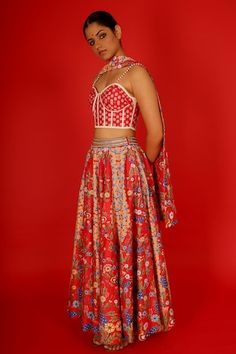 Red chanderi lehenga with floral hand painted motifs and abstract hand embroidered waistband. Comes with a blouse and a tie-dupatta. - Aza Fashions Fitted Red Art Silk Palazzo Set, Wedding Palazzo Set With Motifs, Designer Fitted Lehenga With Motifs, Designer Fitted Palazzo Set With Motifs, Red Fitted Anarkali Set With Motifs, Fitted Red Anarkali Set With Motifs, Fitted Lehenga With Motifs For Reception, Designer Wear Red Choli With Motifs, Designer Red Dresses With Motifs