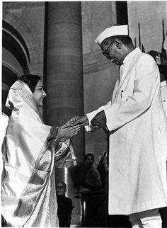 an old black and white photo of two men shaking hands