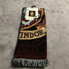 a towel with the word indor on it laying on top of carpeted floor