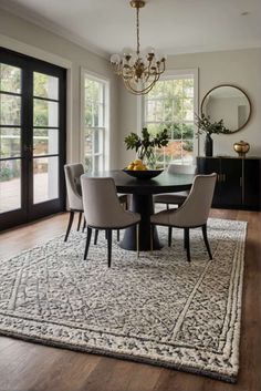 sleek and elegant dining room ideas with lore weaved rug 2 Dining Rooms With Round Tables, Elegant Dining Room Ideas, Dining Room With Round Table, Dining Room Colour Schemes, Luxurious Decor, Eclectic Wallpaper, Cabinet Options, Mcm Furniture